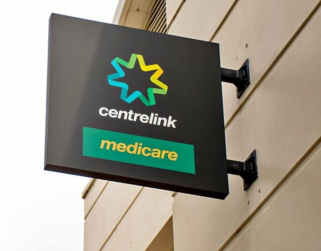 Double-sided blade sign with side brackets
