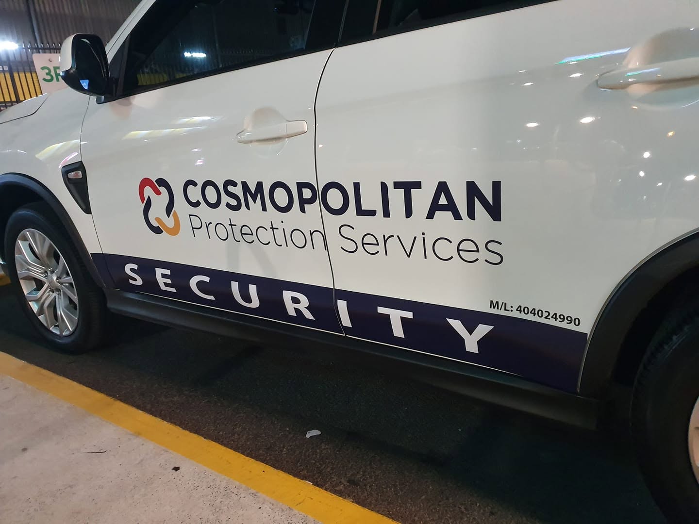 Cut vinyl fleet decals on a security patrol vehicle