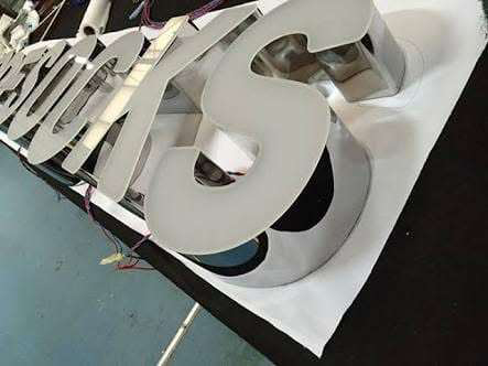 Stainless channel letters under fabrication in the workshop